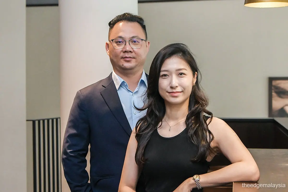 Ng (right, seen here with Lim): We are not an explosive growth kind of business, but in good times or bad, there will always be demand for our products (Photo by Zahid Izzani/The Edge)